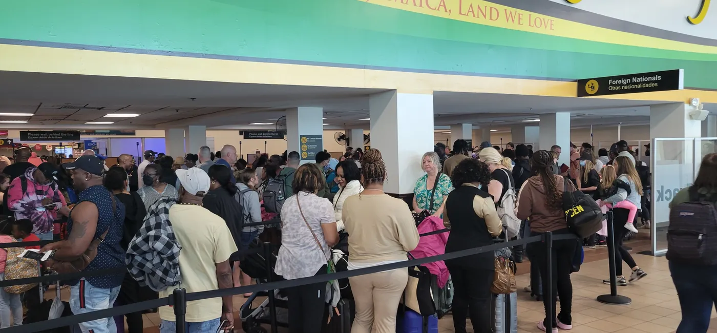 Travelers waiting in long lines at Sangster International Airport (MBJ) in Montego Bay